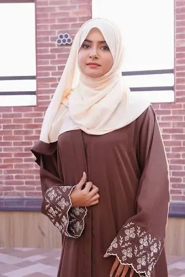 Floral embroidered scalloped cuff on a brown abaya